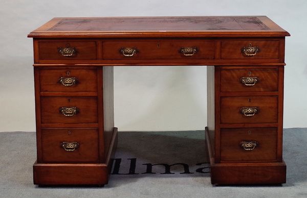 'William Whiteley, London', an early 20th century walnut pedestal desk with nine drawers about the knee