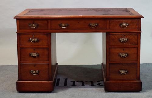'William Whiteley, London', an early 20th century walnut pedestal desk with nine drawers about the knee