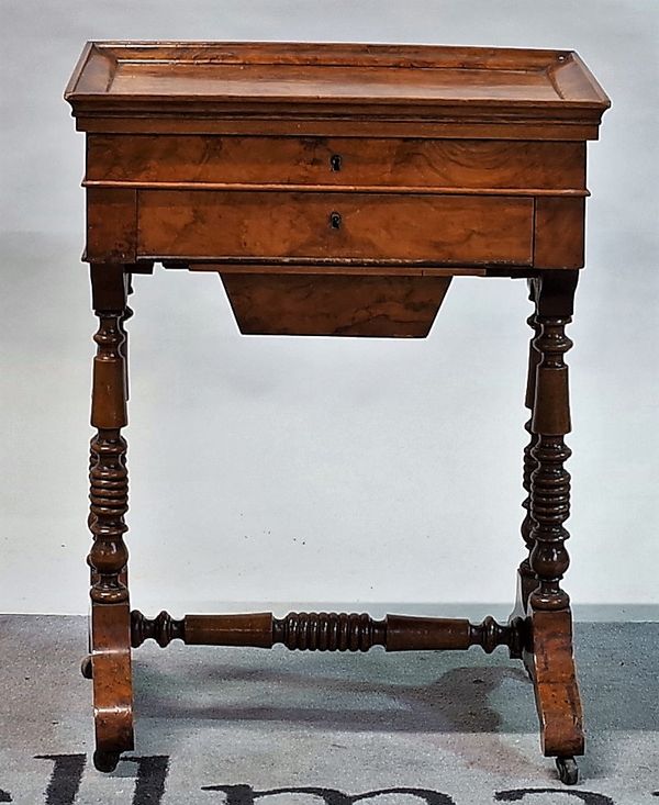 A Continental walnut work table