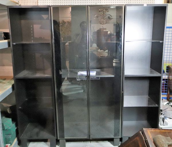 A modern black painted hardwood triple section display cabinet