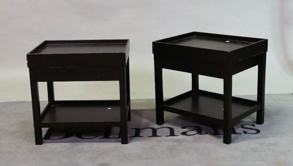 'OKA', a pair of black painted hardwood two tier occasional tables