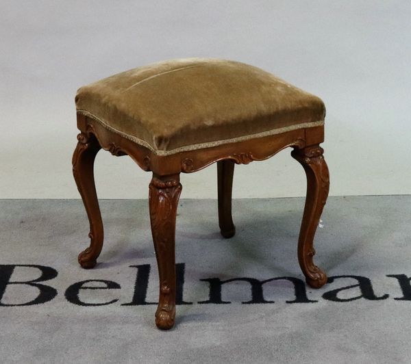 A Louis XV style walnut footstool on carved cabriole supports