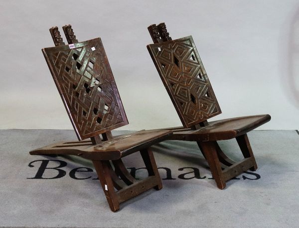 A pair of early 20th century African folding chairs, 33cm wide; 78cm high (2) 5980