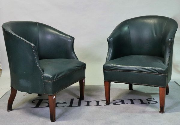 A pair of early 20th century oak framed tub chairs on tapering square supports