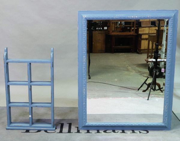 A modern blue painted rectangular mirror