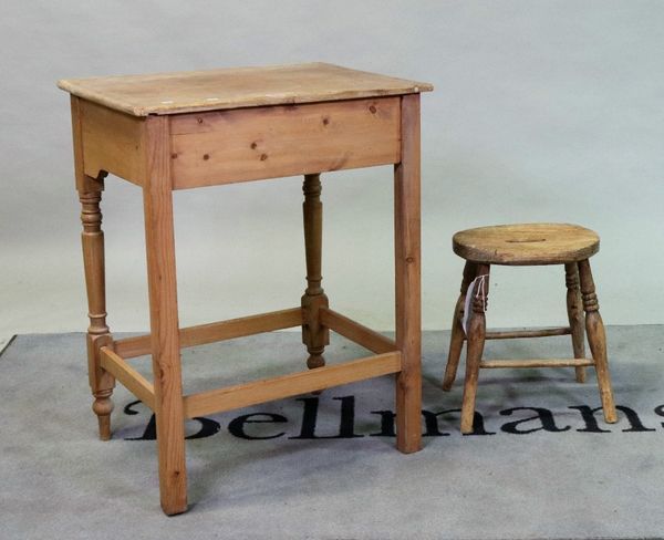 An early 20th century pine side table