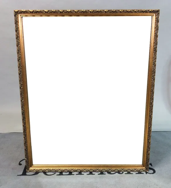 A large modern gilt rectangular mirror