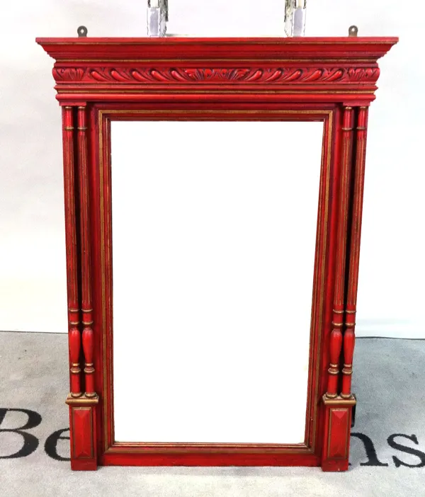 A red painted parcel gilt rectangular mirror