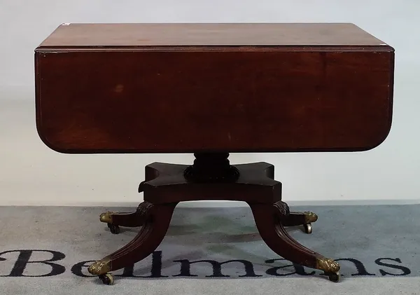 A George III mahogany drop flap centre table