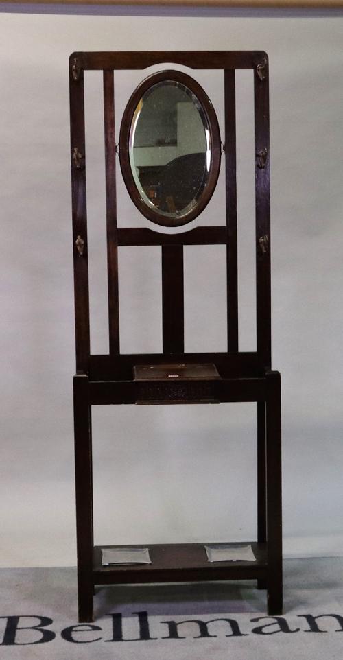 An early 20th century oak hall stand