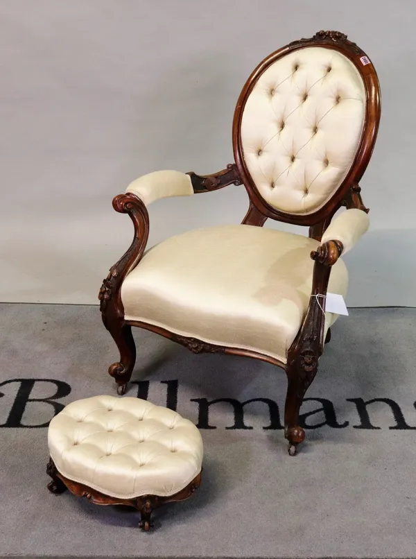 A Victorian walnut framed low open armchair
