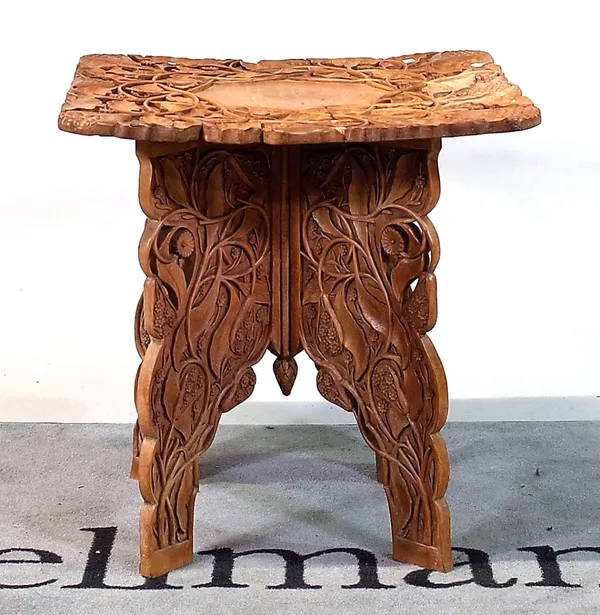 A mid-20th century Eastern carved folding table