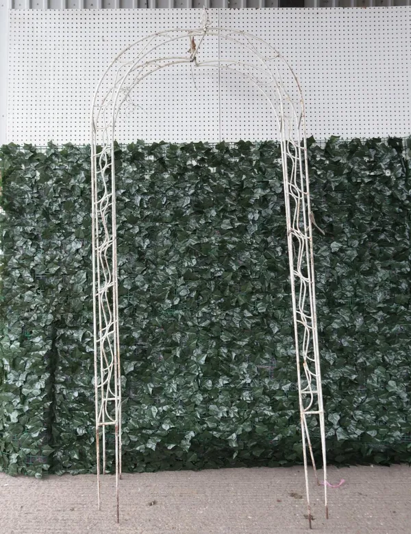 A early 20th century white painted metal garden arch, 100cm wide; 225cm high (a.f)