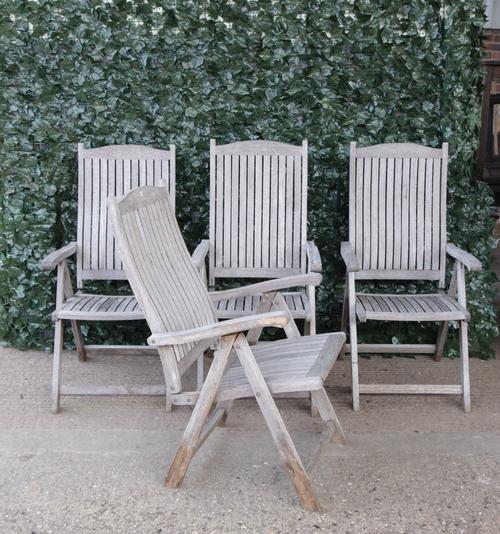 ‘FIRMAN’ A set of four modern teak folding garden open armchairs. 58cm wide; 88cm high (4)