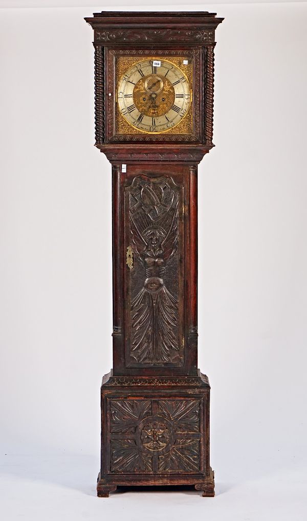 A carved oak eight-day longcase clock