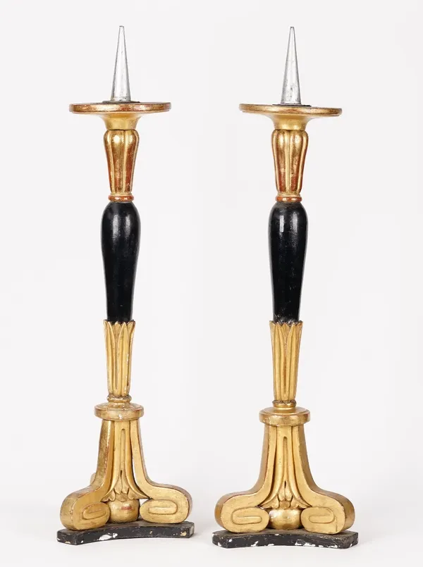 A pair of gilt gesso and black painted pricket sticks