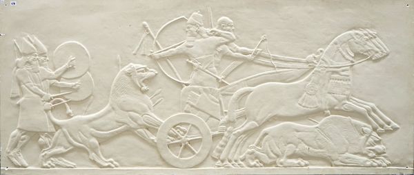 A large plaster relief wall panel, depicting a typical Assyrian lion-hunting scene