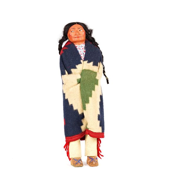 A Native American softwood and composition doll