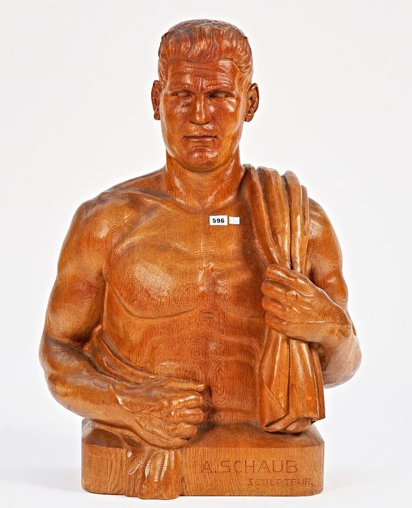 A carved oak male bust with torso