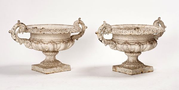 A pair of Victorian white painted cast-iron urns
