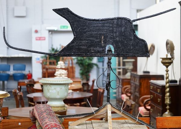 A black painted wrought and sheet iron weather vane