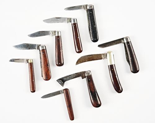 Eight wooden handled pocket knives (9)