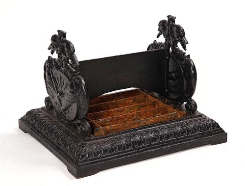 Possibly Coalbrookdale; a black painted cast-iron boot scraper.
