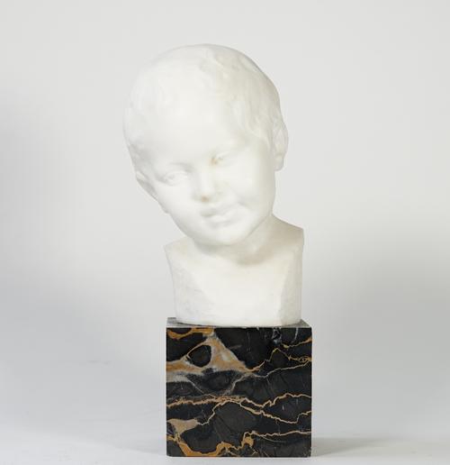 A white marble bust of a child