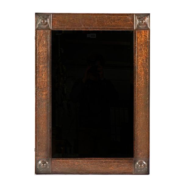 An Arts and Crafts copper rectangular wall mirror