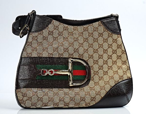 A GUCCI CANVAS AND BROWN LEATHER SHOULDER BAG