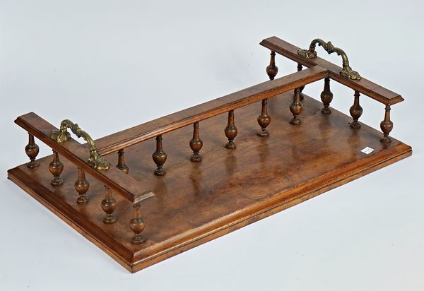 A Victorian figured walnut twin section book tray with turned gallery, 61cm wide; 37cm deep