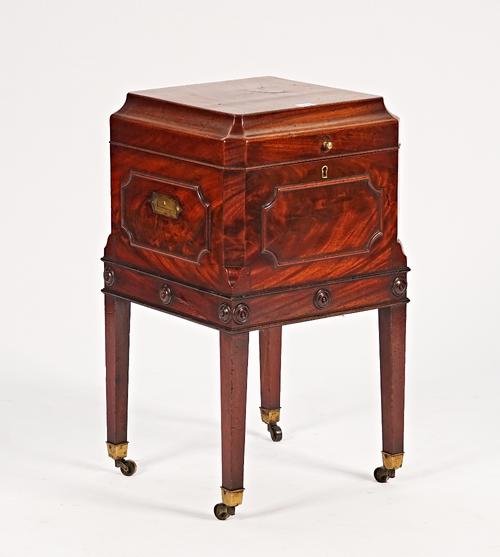A George III mahogany caddy top square cellarette