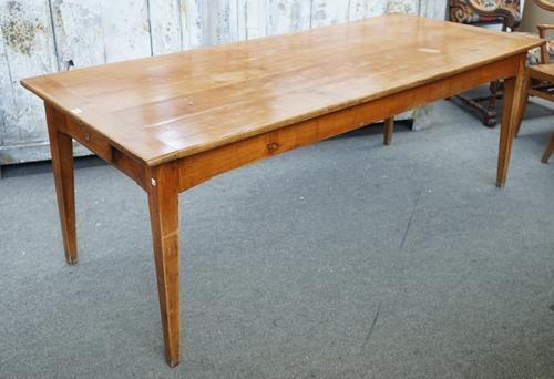 A 19th century French cherrywood plank-top kitchen table