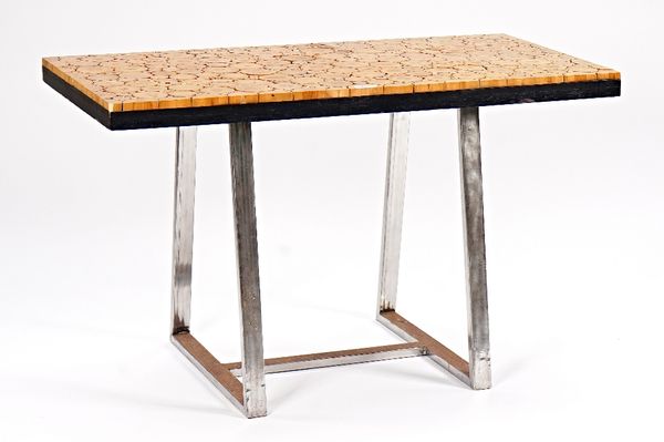 A 20th century centre table, the rectangular top inset with laburnum rounds on polished chrome base, 120cm wide x 73cm high.