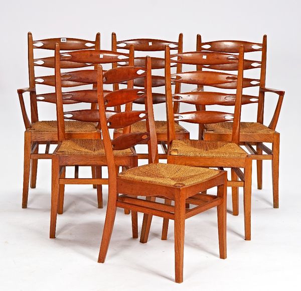 A set of six mid-20th century yew and oak dining chairs with pierced ladder backs on splayed square supports, to inlcude a pair of carvers (6).