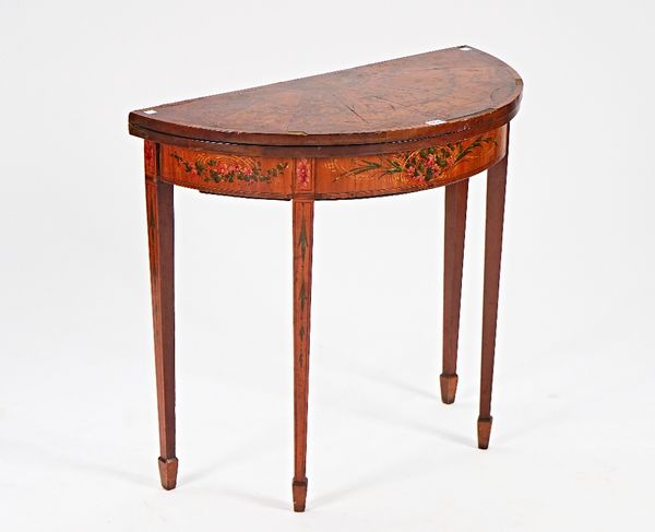 A George III style polychrome painted demi-lune card table on tapering square supports, 83cm wide x 73cm high.