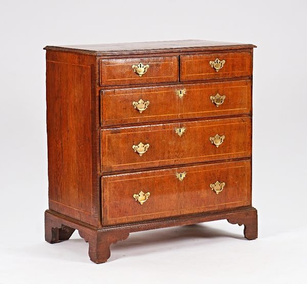 A mid-18th century oak chest with two short and three long graduated drawers on bracket feet, 92cm wide x 99cm high.