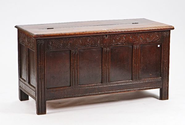 A 17th century oak coffer, with carved frieze and a four panelled front, 142c, wide x 74cm high