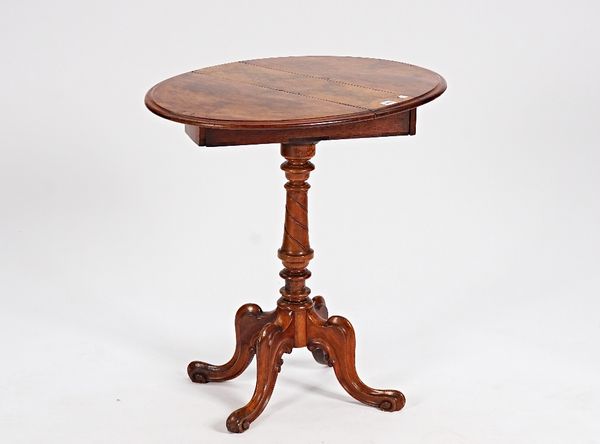 A Victorian figured walnut oval drop flap occasional table, on spiral column and scroll supports, 56cm wide x 73cm high.