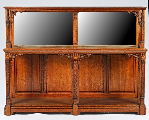 A 19th century oak Gothic Revival mirror back three tier side cabinet, 190cm wide x 145cm high.
