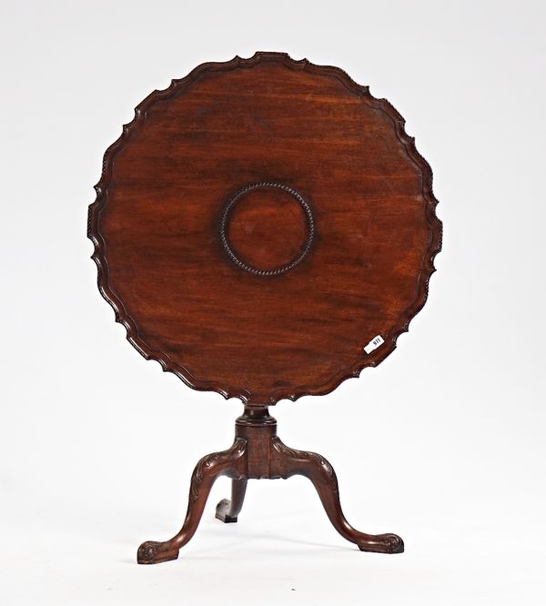 An 18th century Irish mahogany occasional table, the shaped snap top on birdcage mount and tripod base, 84cm diameter x 70cm high.