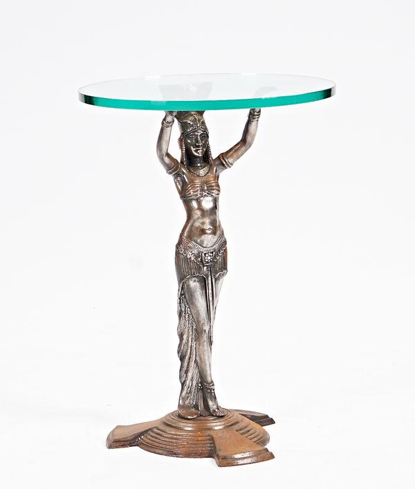 An Art Deco table, the circular glass top on cast metal, 50cm diameter x 73cm high.