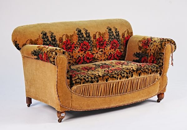 A mid-20th century small Chesterfield style sofa, on turned supports, 143cm wide x 78cm high.