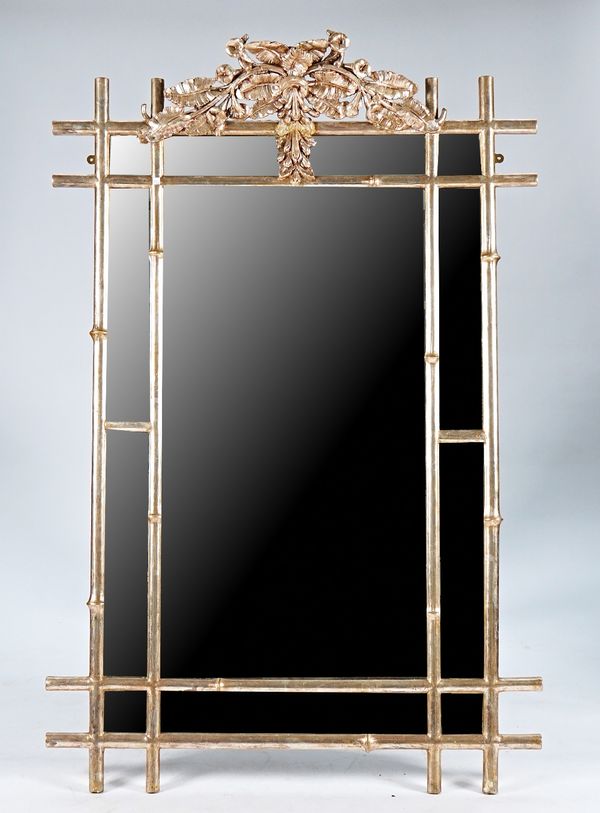 A silver painted rectangular mirror with faux bamboo marginal border and foliate crest, 119cm wide x 180cm high.