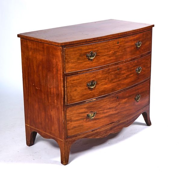 A REGENCY BOWFRONT MAHOGANY CHEST