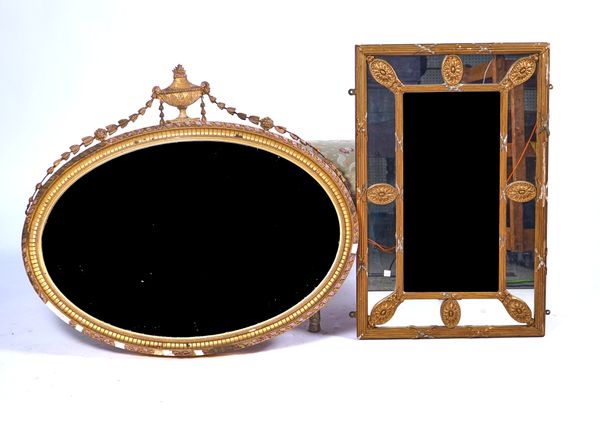 AN EARLY 20TH CENTURY GILT FRAMED OVAL MIRROR