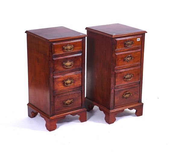 A PAIR OF WALNUT FOUR DRAWER BEDSIDE CHESTS