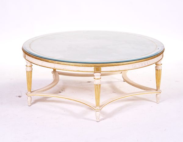 A MODERN CREAM AND GOLD CIRCULAR COFFEE TABLE