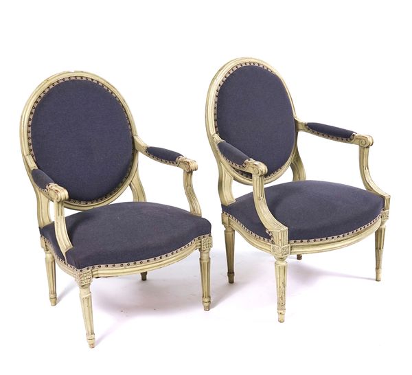 A PAIR OF GREEN PAINTED LOUIS XVI STYLE OPEN ARMCHAIRS
