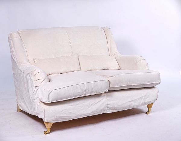 A MODERN TWO SEATER SOFA